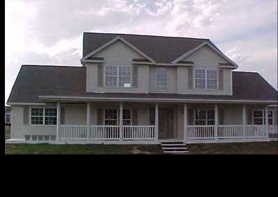 2 story home with wrap around deck